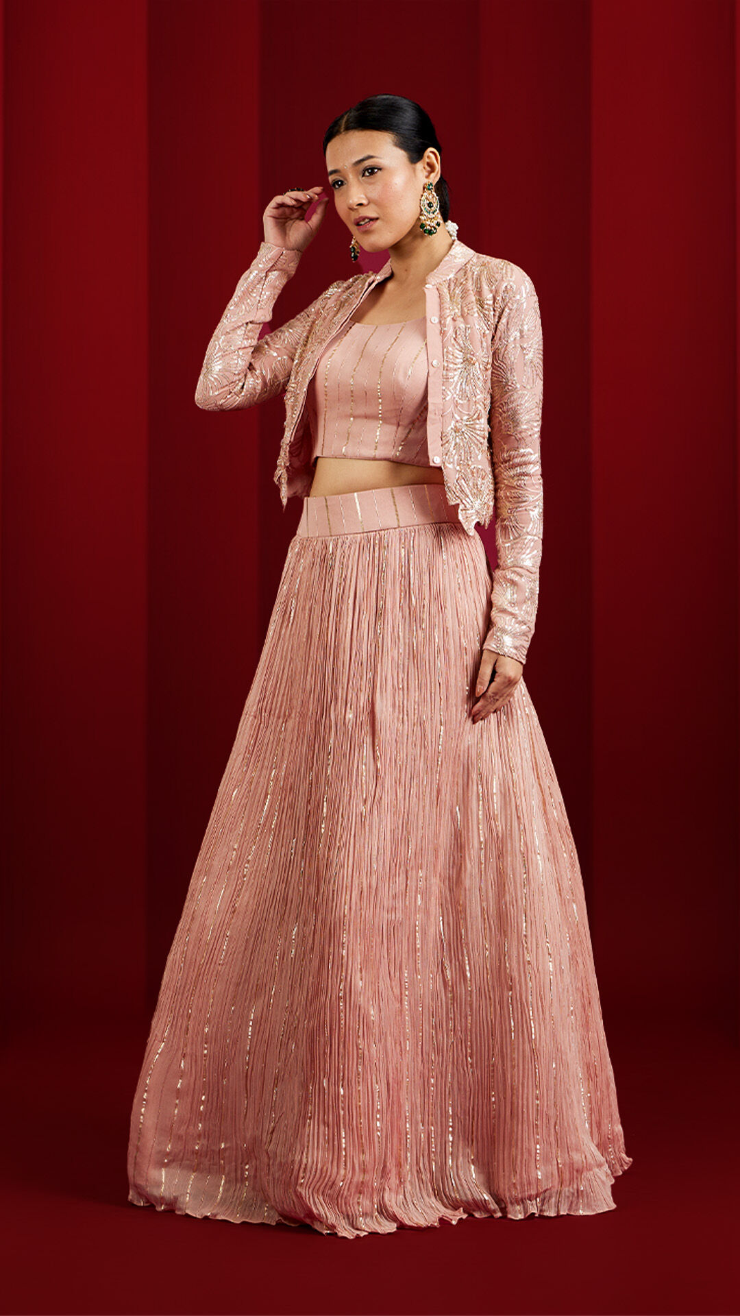A woman showcasing a stylish pink modern lehenga, perfect for a contemporary bridal look.